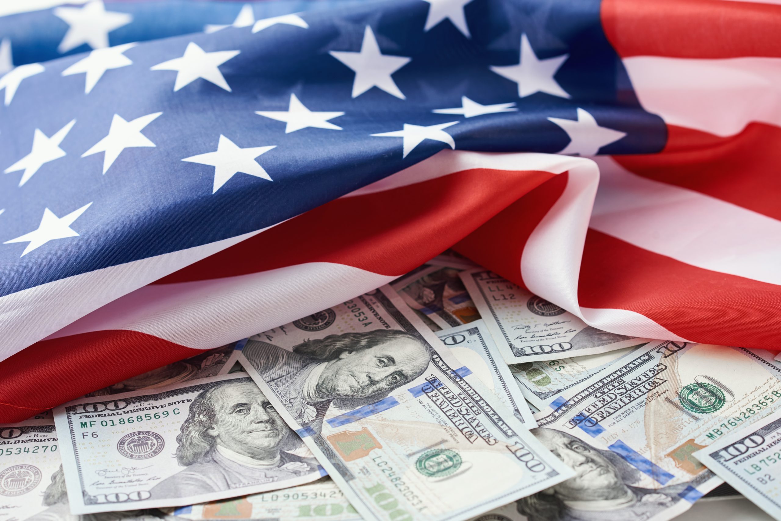 USA national flag and dollar bills. Business and finance concept